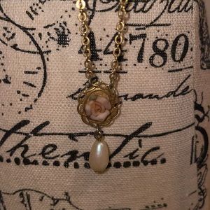Vintage 1928 pink flower on bezel with dropped faux pearl, approx. measures 16”